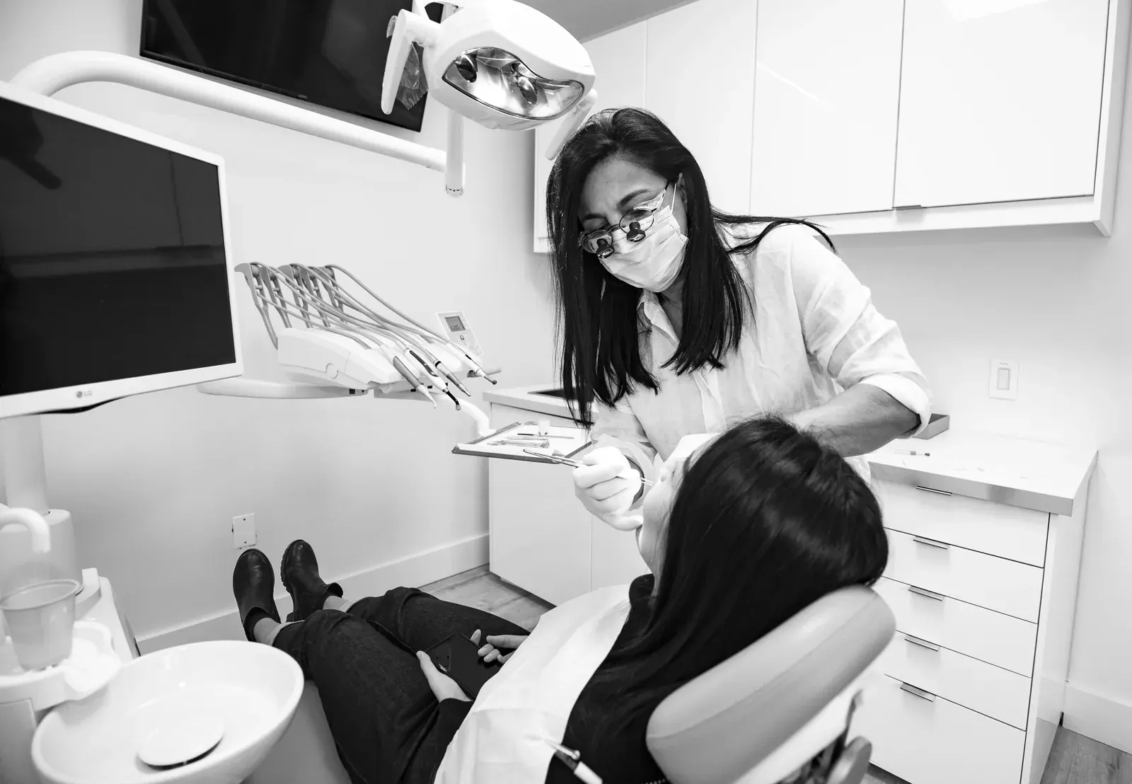 Dr. Patricia Moezinia reviewing a digital smile design with a patient